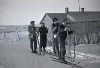 Alf and Edie Chapman's family and farm house with buildings. Jim, Grace, Fred and Ernie skiing to Wainfleet School.