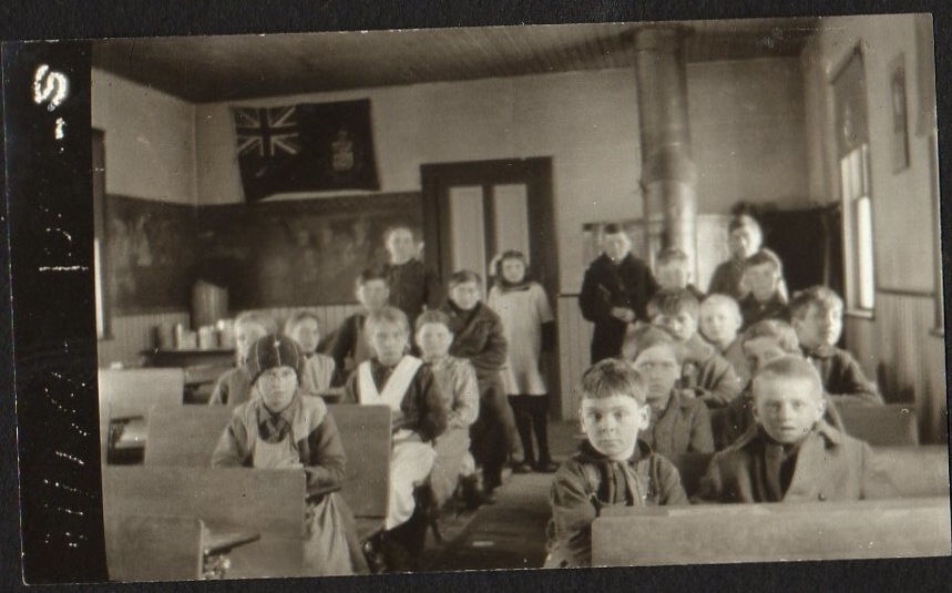 Class picture in one of the Saskatchewan country schools in the teaching days of William Eldon Janzen, DDS (1896-1977) 