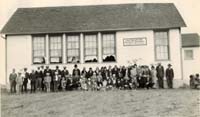 Viola Zeller holding baby Yvonne (in school window) 1928 at Valentine School district school on a visit to Penant, Sask from Nippewan Sask